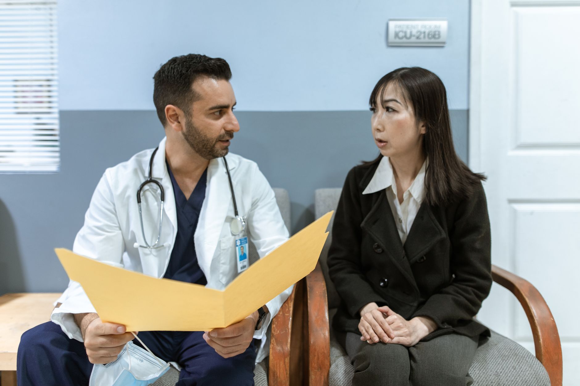A doctor talking with a patient during a consultation