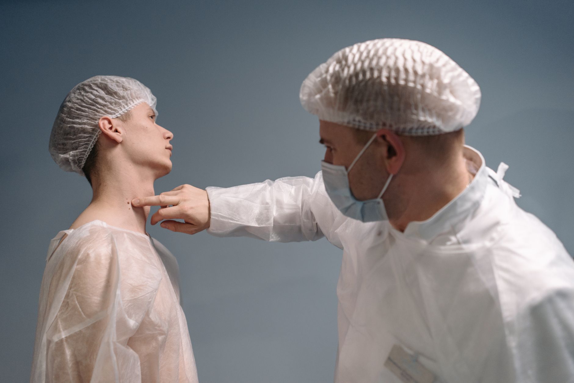 A doctor examining a patient in an exam room